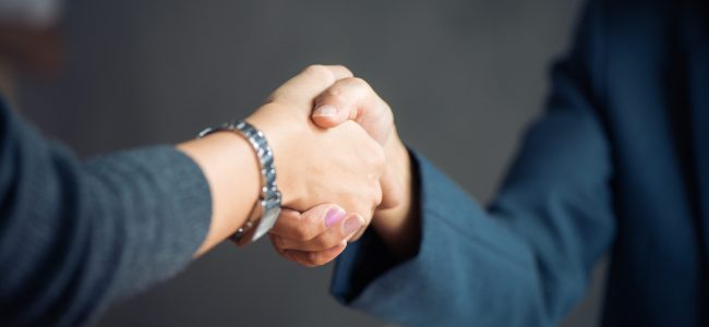 Negotiating business,Image businesswomen handshake,happy with work,business woman she is enjoying with her workmate,Handshake Gesturing People Connection Deal Concept. Vintage effect style pictures.